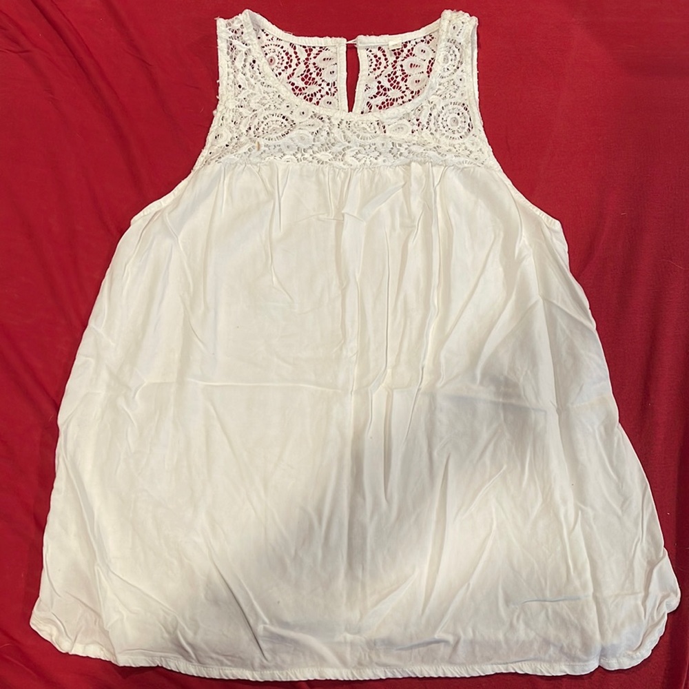 White flowy tank top. With design on top.